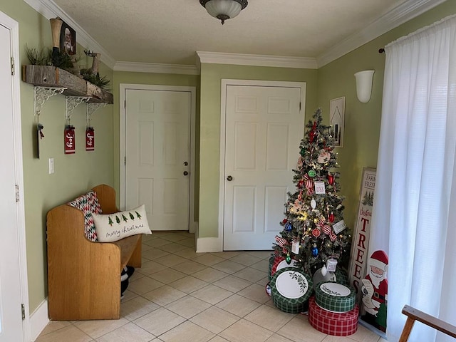 entrance foyer featuring light tile patterned flooring and ornamental molding