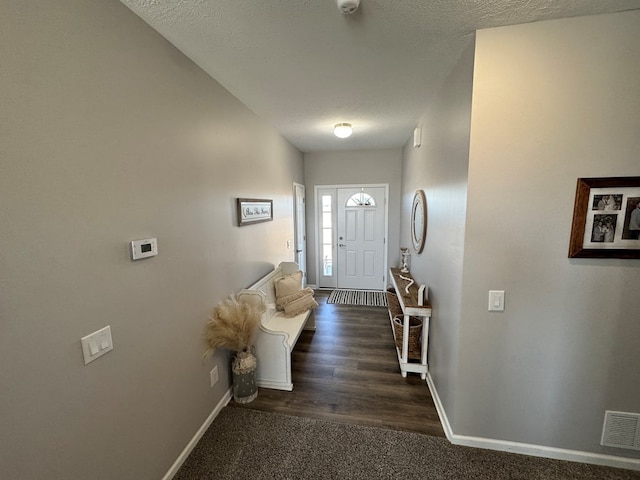 entrance foyer with a textured ceiling