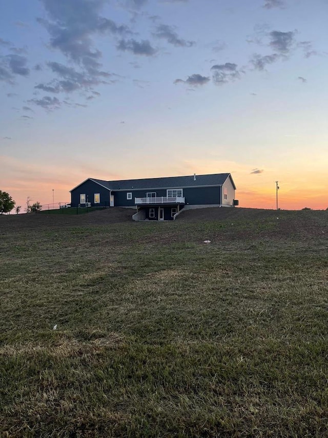 view of front of home featuring a lawn