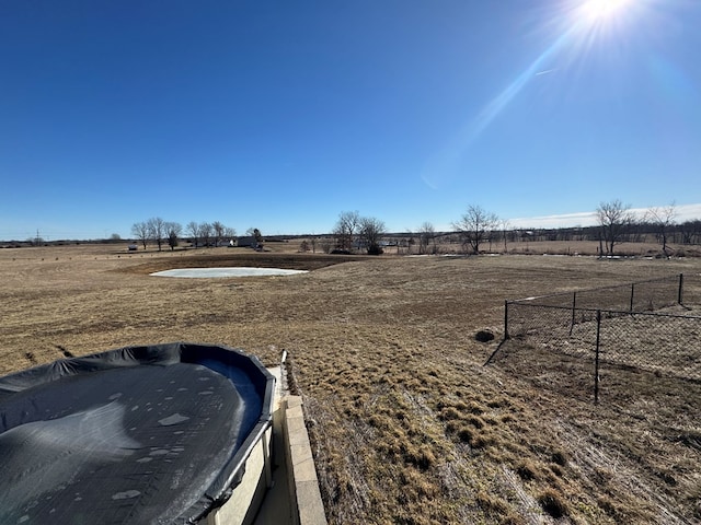 view of yard with a rural view