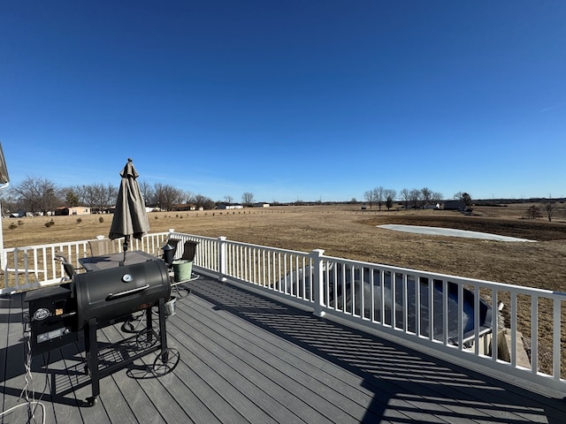 wooden terrace with a rural view