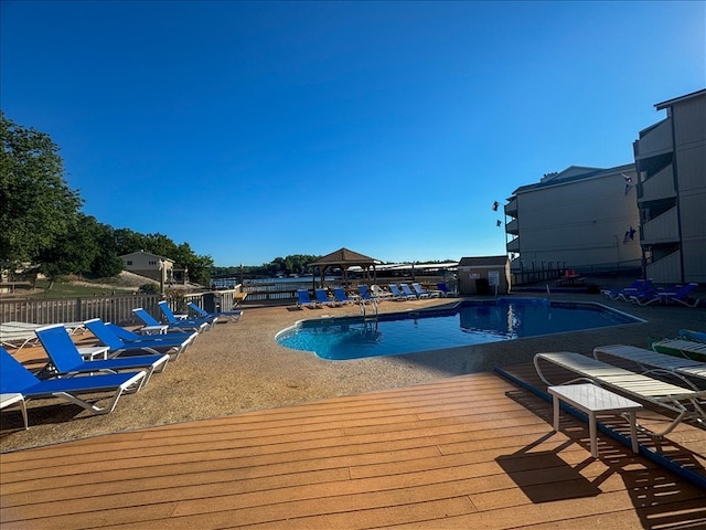 view of pool featuring a deck and a patio area