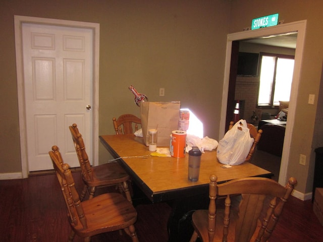 dining area featuring dark hardwood / wood-style floors