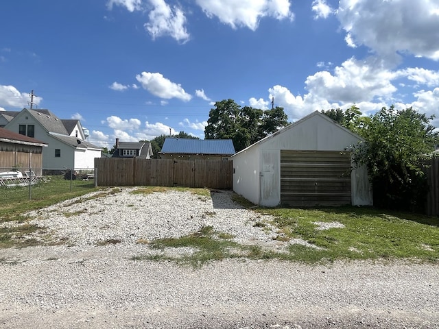 115 Polk St, Chillicothe, MO 64601 - view of yard featuring an outdoor structure, an outbuilding, and a detached garage