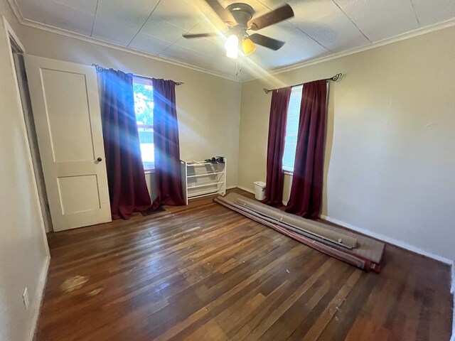 115 Polk St, Chillicothe, MO 64601 - spare room with ornamental molding, hardwood / wood-style floors, a ceiling fan, and baseboard heating