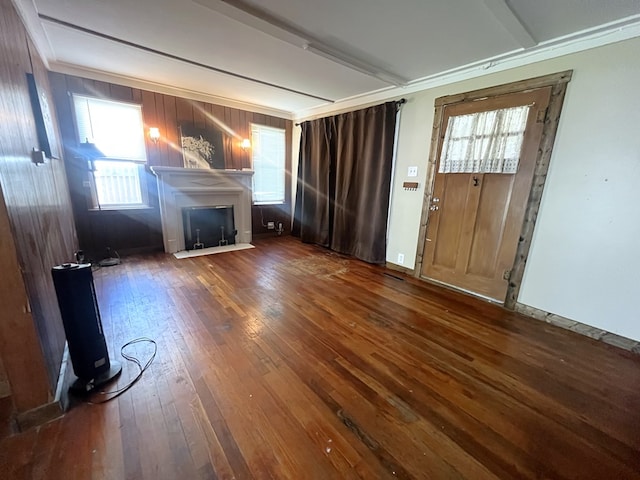 115 Polk St, Chillicothe, MO 64601 - unfurnished living room featuring hardwood / wood-style flooring, a fireplace, and ornamental molding