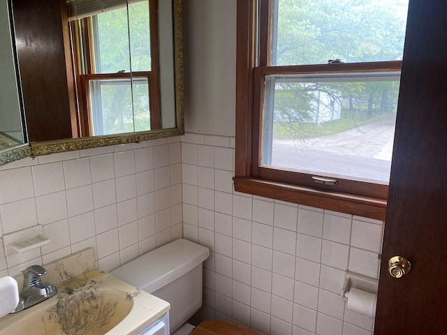 1216 Alexander, Chillicothe, MO 64601 - bathroom featuring tile walls, toilet, plenty of natural light, and a sink