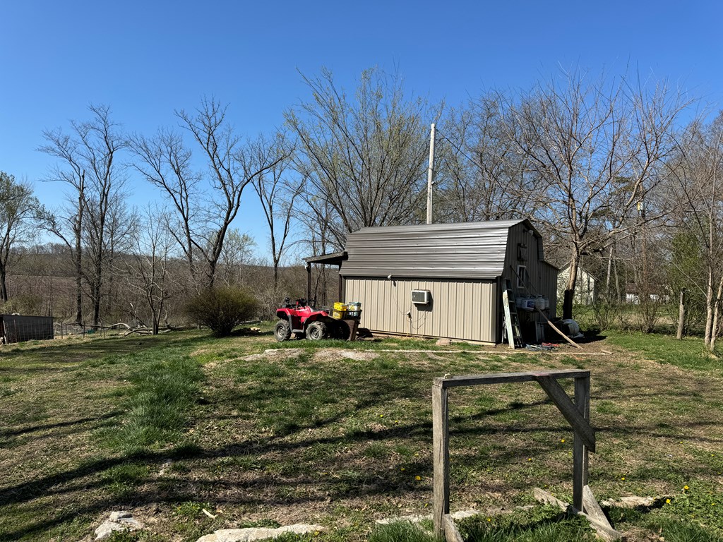 19201 Hopalong Trl, Novinger, MO 63559 - view of yard with a storage shed and an outdoor structure