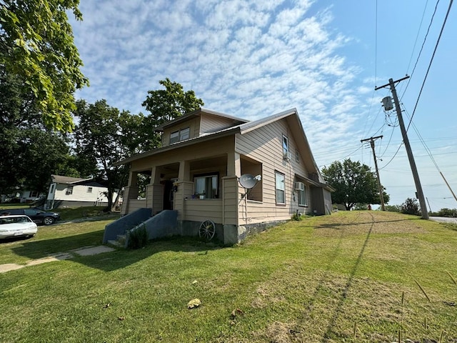 bungalow-style home featuring a front lawn