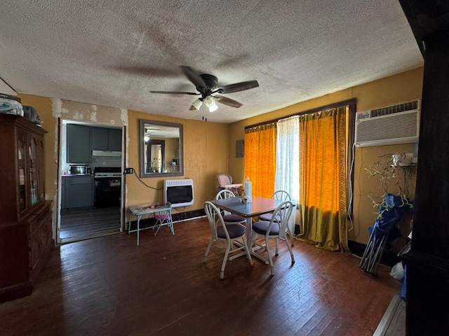 dining area with ceiling fan, dark hardwood / wood-style flooring, a textured ceiling, and heating unit