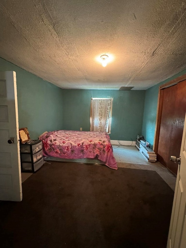 bedroom featuring a textured ceiling