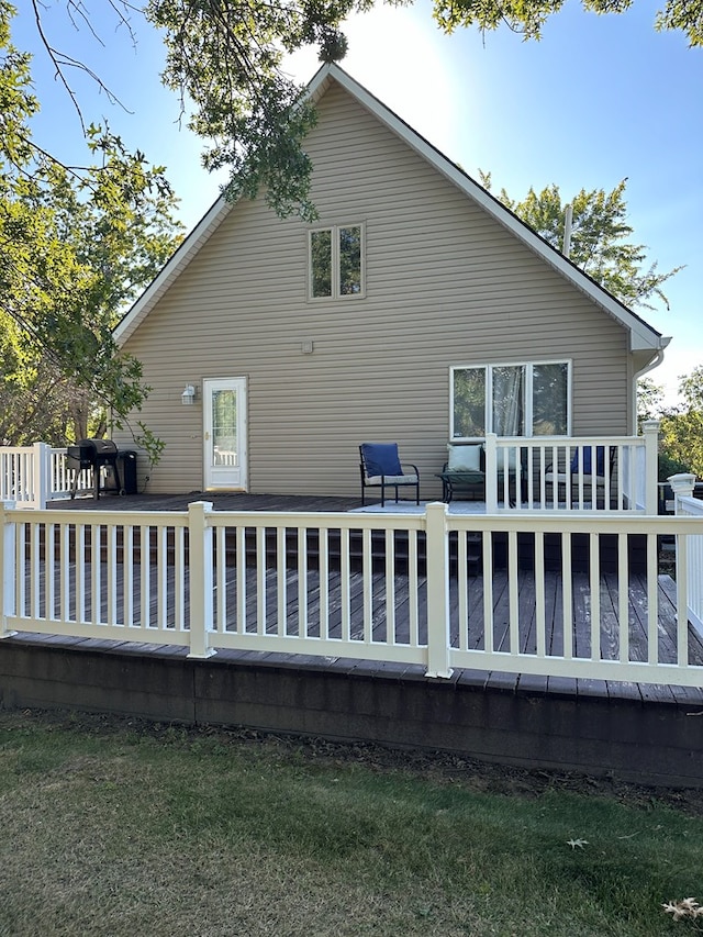 rear view of house with a wooden deck