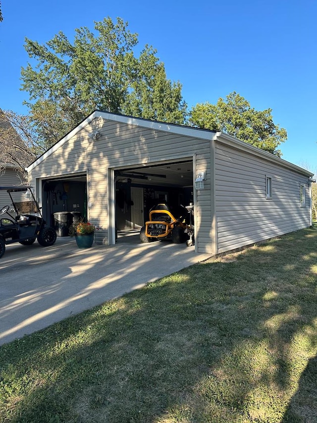 garage featuring a yard