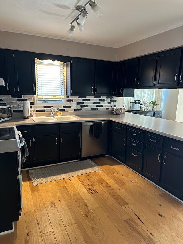 laundry room with light hardwood / wood-style floors and independent washer and dryer