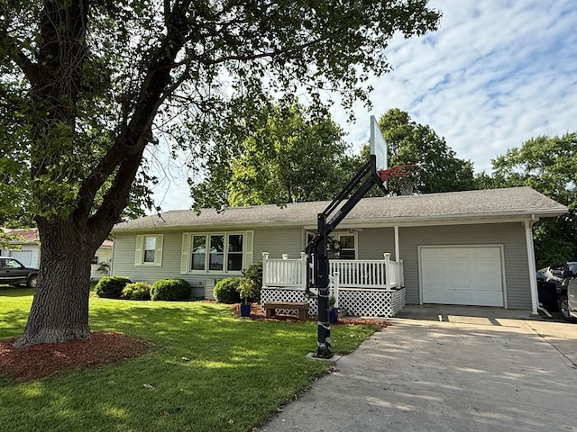 609 E Clark St, La Plata, MO 63549 - ranch-style house featuring a garage, concrete driveway, and a front lawn