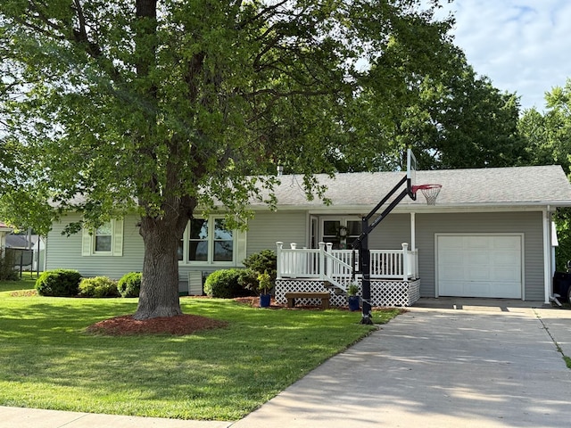 609 E Clark St, La Plata, MO 63549 - view of front of home featuring a garage, a front lawn, and driveway