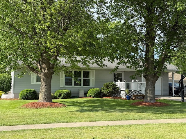 609 E Clark St, La Plata, MO 63549 - view of property hidden behind natural elements featuring a garage, a front yard, and a porch