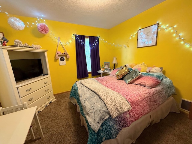 609 E Clark St, La Plata, MO 63549 - bedroom with carpet, a textured ceiling, and baseboards
