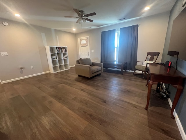 living area with a ceiling fan, recessed lighting, dark wood-style floors, and baseboards