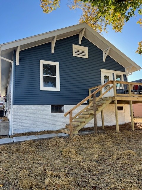 view of property exterior featuring a deck