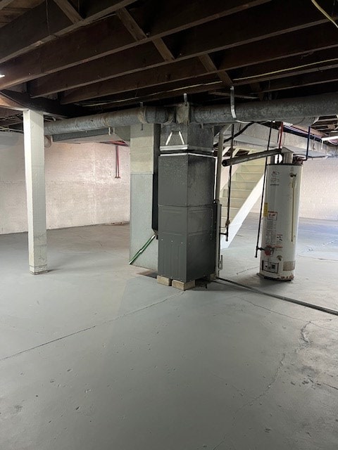 basement with heating unit and gas water heater