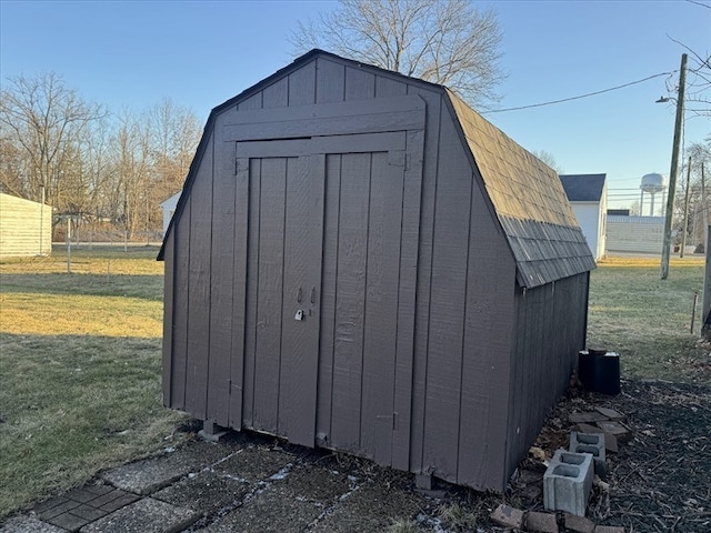 view of outdoor structure with a lawn