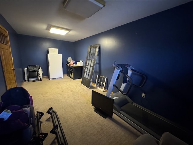 workout room with carpet flooring and french doors