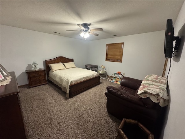 carpeted bedroom featuring ceiling fan and a textured ceiling