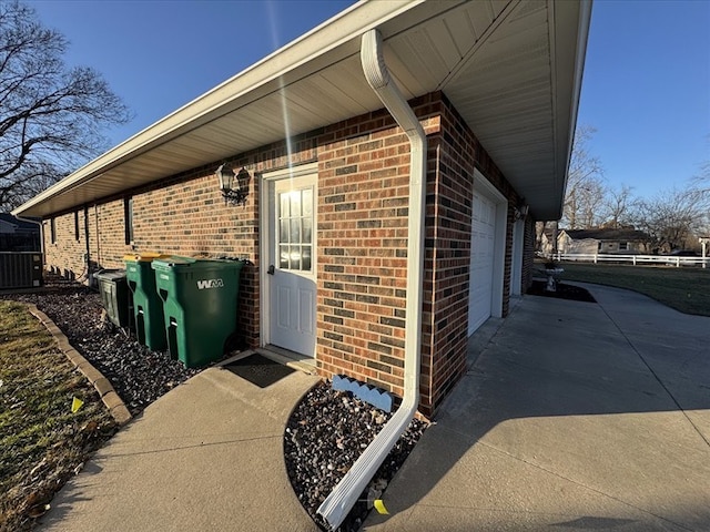 view of side of home with a garage