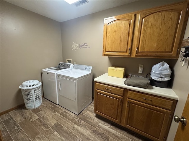 laundry room with cabinets and independent washer and dryer