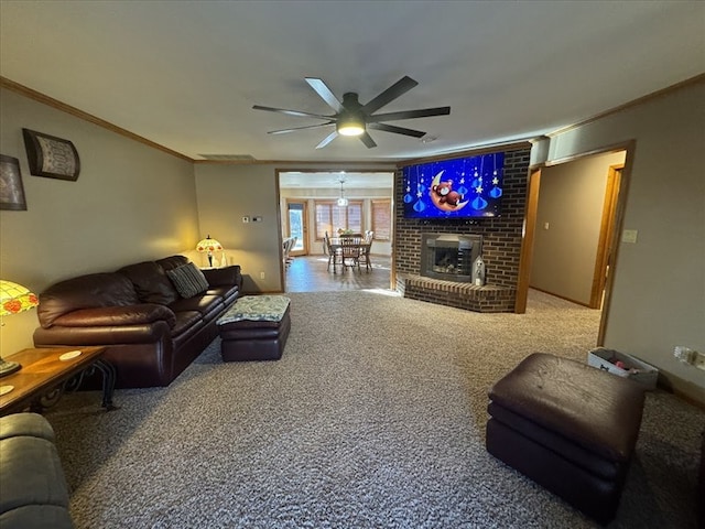 carpeted living room featuring crown molding, a brick fireplace, and ceiling fan