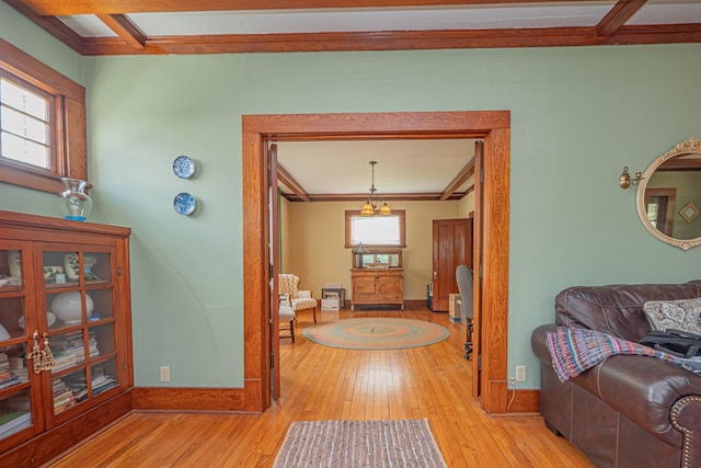 409 E Elm St, Huntsville, MO 65259 - bathroom with ornamental molding, baseboards, and hardwood / wood-style flooring
