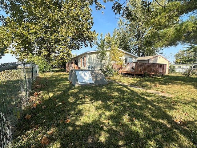 view of yard featuring a wooden deck