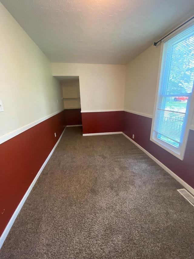 701 E Cottonwood, Kirksville, MO 63501 - empty room with carpet flooring and a textured ceiling