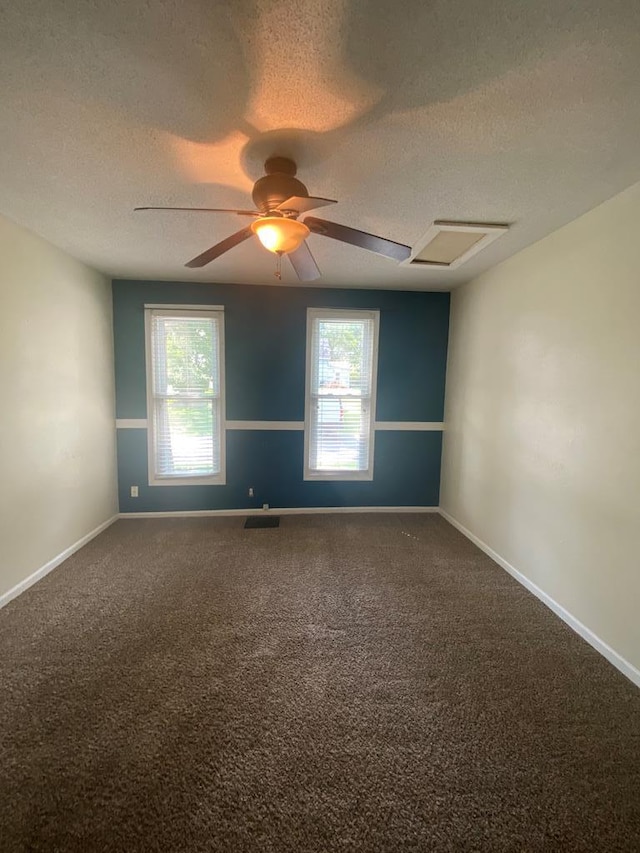 701 E Cottonwood, Kirksville, MO 63501 - spare room with carpet flooring, ceiling fan, plenty of natural light, and a textured ceiling