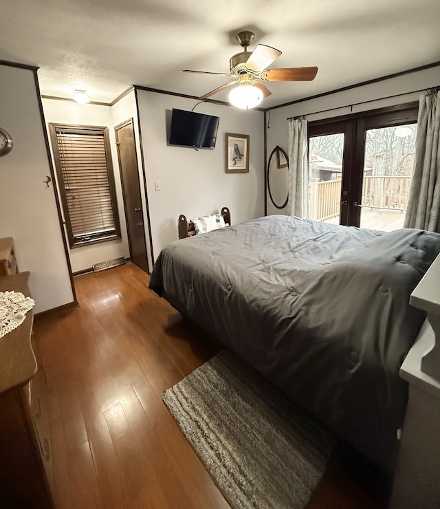 bedroom featuring ceiling fan, french doors, light wood-type flooring, access to outside, and ornamental molding