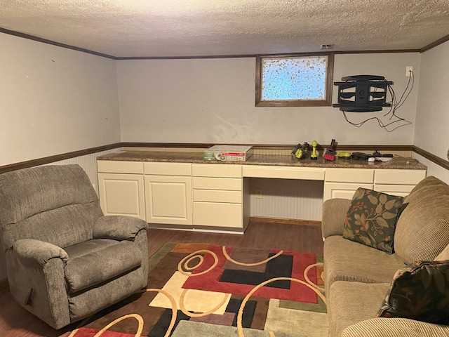 living room featuring dark hardwood / wood-style floors and a textured ceiling