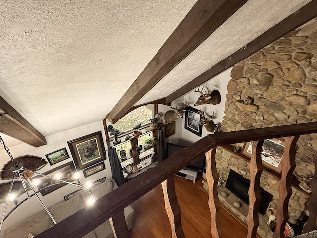 interior space with beamed ceiling and wood-type flooring