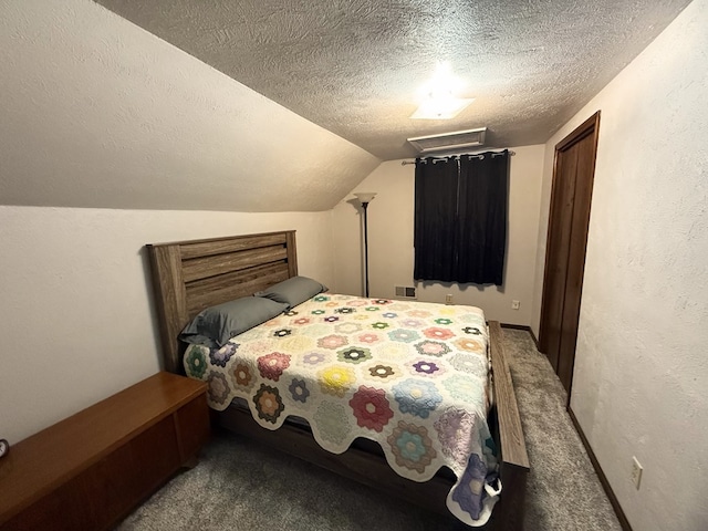 carpeted bedroom with vaulted ceiling and a textured ceiling