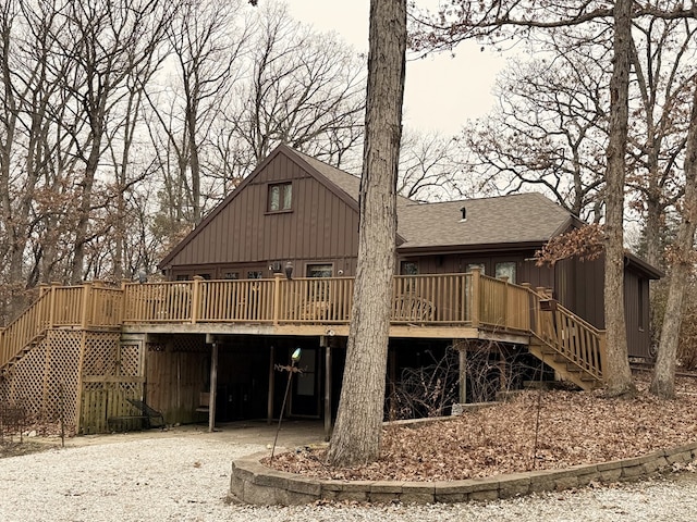 back of house featuring a wooden deck