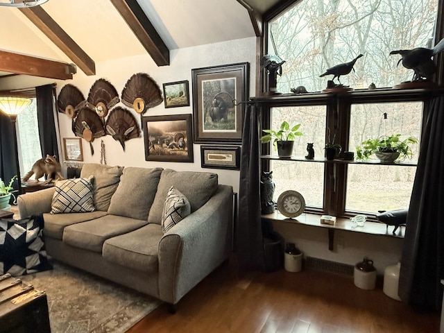 living area with vaulted ceiling with beams and hardwood / wood-style flooring