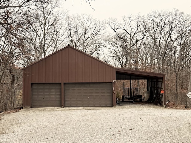 garage featuring a carport