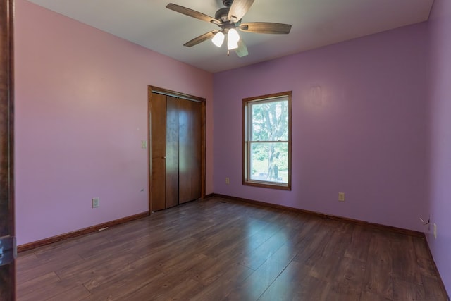 25340 SW Blvd, Bevier, MO 63532 - spare room featuring dark wood finished floors and a ceiling fan