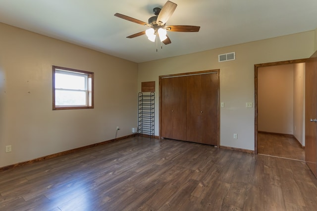 25340 SW Blvd, Bevier, MO 63532 - unfurnished bedroom with a closet, dark wood-type flooring, and ceiling fan