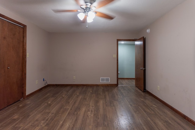 25340 SW Blvd, Bevier, MO 63532 - unfurnished bedroom featuring dark wood finished floors and ceiling fan
