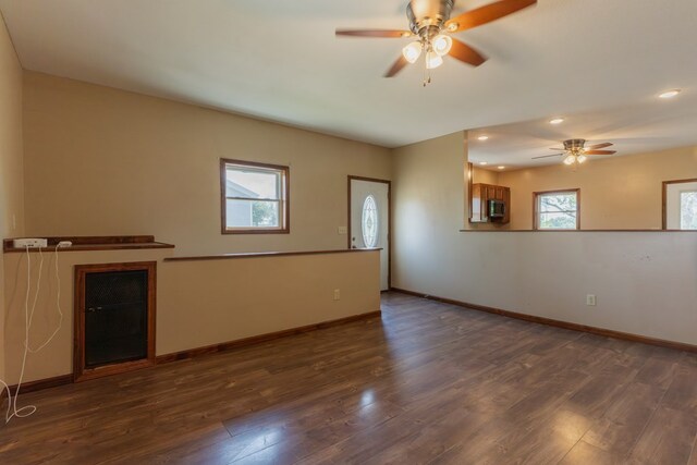 25340 SW Blvd, Bevier, MO 63532 - unfurnished living room featuring a ceiling fan, dark wood-style flooring, and recessed lighting