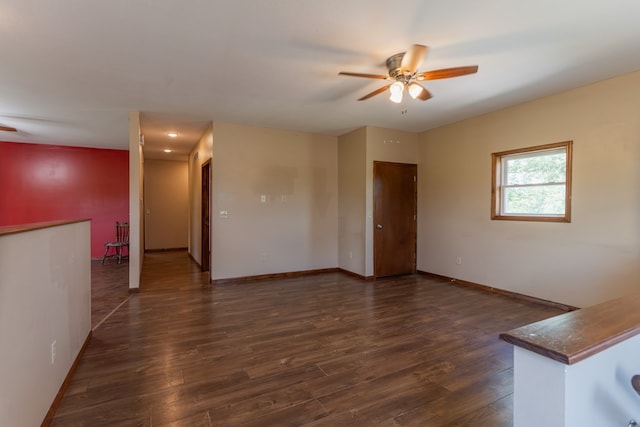 25340 SW Blvd, Bevier, MO 63532 - empty room with a ceiling fan and dark wood-style flooring