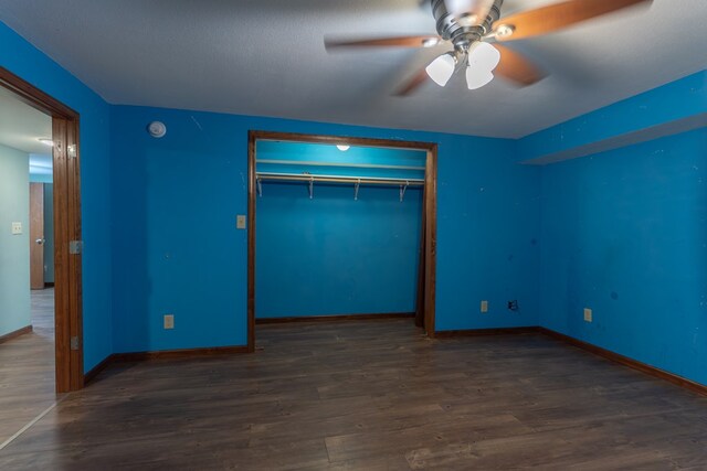 25340 SW Blvd, Bevier, MO 63532 - unfurnished bedroom featuring a closet, wood finished floors, and ceiling fan