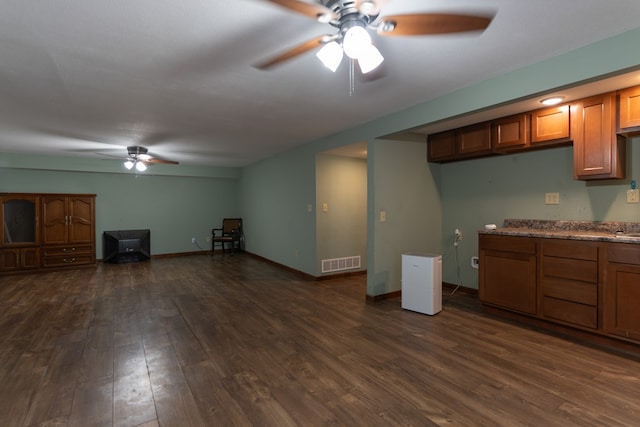 25340 SW Blvd, Bevier, MO 63532 - unfurnished living room with ceiling fan and dark wood-type flooring