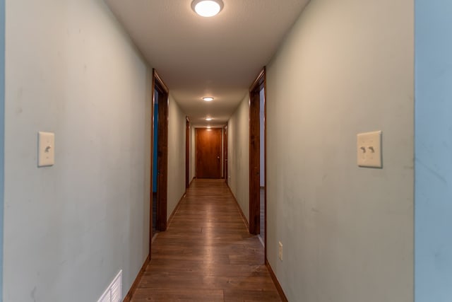 25340 SW Blvd, Bevier, MO 63532 - hallway with dark wood-type flooring and baseboards